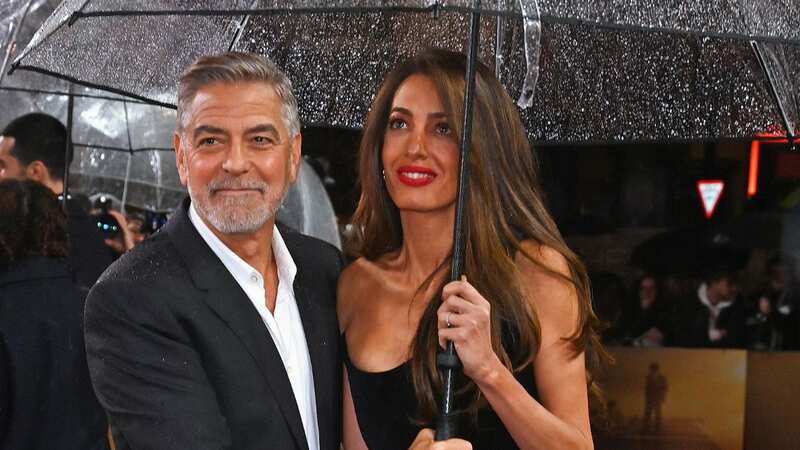 George Clooney lovingly holds wife Amal and protects her at new movie premiere
