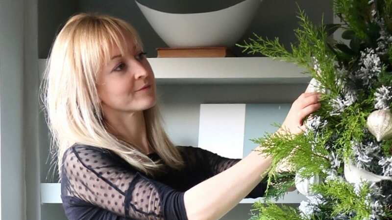 Claire pimps her old artificial Christmas tree every year to make it look like a real one using plants from her garden (Image: Claire Douglas)