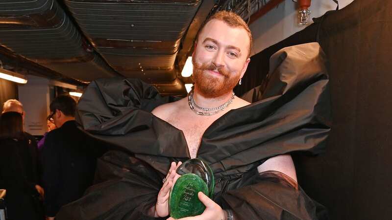 Sam Smith stuns in ballgown to collect fashion award after wowing on red carpet