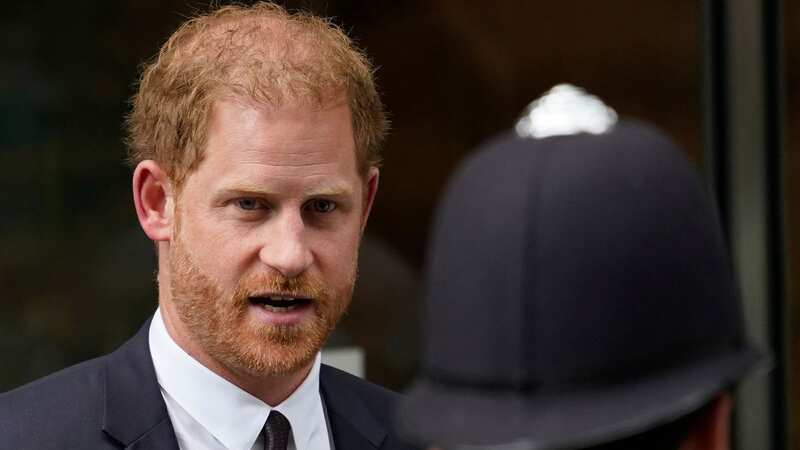 Prince Harry outside court (Image: AP)