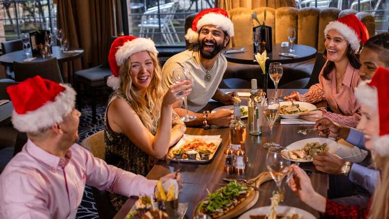 Brits are planning at least two group meals in the run-up to Christmas - and could snag up to £28 million in rewards across the festive season (Image: SolStock/Getty Images)