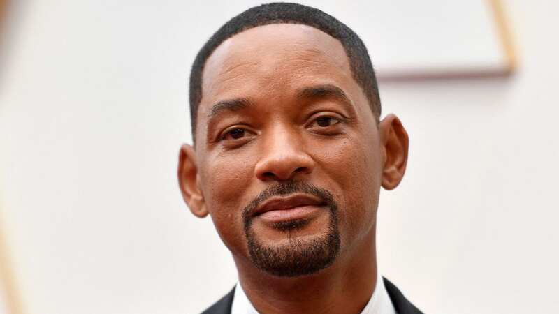 Actor Will Smith was seen with a mystery woman that looks very similar to his estranged wife (Image: getty)
