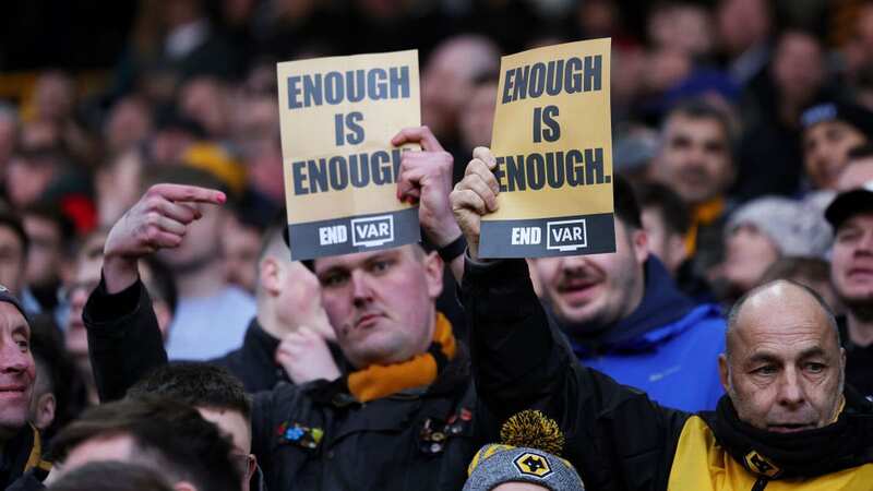 Fans of Wolverhampton Wanderers hold VAR protest signs prior to the Premier League match vs Forest (Image: Richard Heathcote/Getty Images)