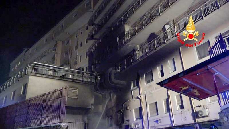 Italian firefighters tackling a fire at the San Giovanni Evangelista Hospital in Tivoli, Italy (Image: AP)