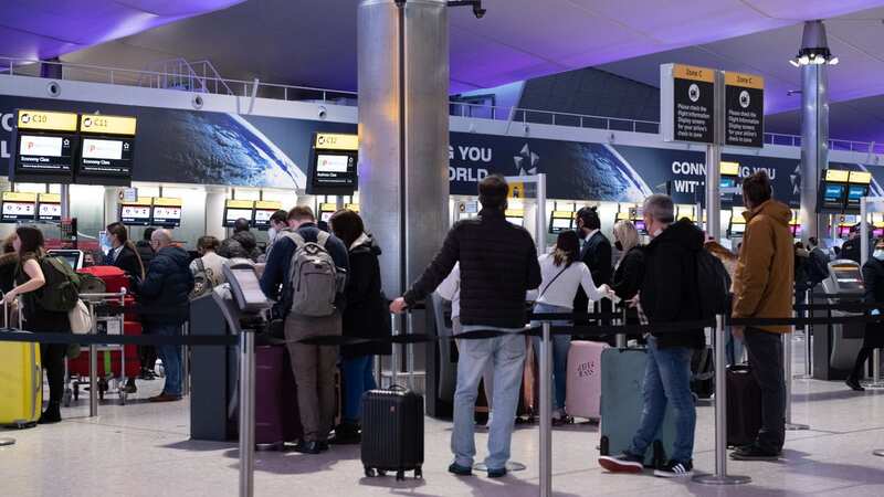 Passengers prepare to check-in for flights at Heathrow Airport (Image: Getty Images)