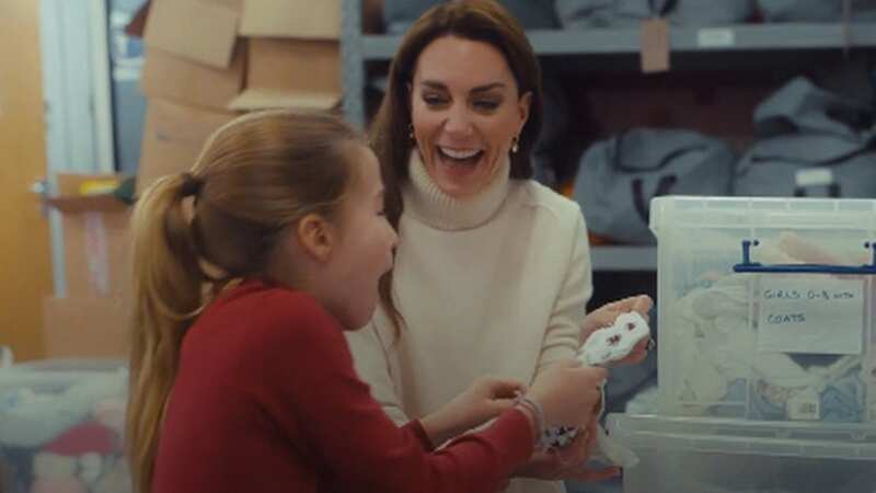 Princess Charlotte picked out a pair of baby clothes on a charity outing with mum Kate Middleton (Image: Handout)