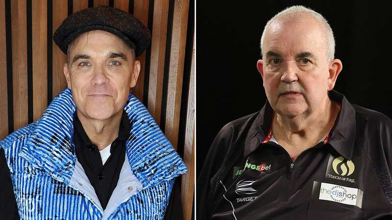 Phil Taylor has revealed that he brings Christmas dinner to Robbie Williams