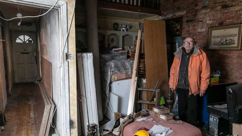 Barry stands in what was his front room (Image: Lee McLean / SWNS)