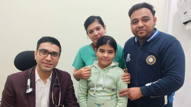 The girl after the surgery with Dr Akshay Buddharaja (Image: No credit)