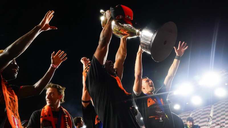 FORT LAUDERDALE, FLORIDA - SEPTEMBER 27: Ifunanyachi Achara #23 of the Houston Dynamo holds the Lamar Hunt U.S. Open Cup trophy after the Dynamo defeated Inter Miami 2-1 in the 2023 Lamar Hunt U.S. Open Cup final at DRV PNK Stadium on September 27, 2023 in Fort Lauderdale, Florida. (Photo by Alex Bierens de Haan/USSF/Getty Images for USSF) (Image: Getty Images for USSF)
