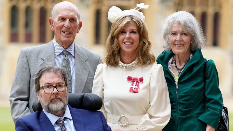 Kate Garraway with her husband Derek Draper when she received her MBE (Image: POOL/AFP via Getty Images)