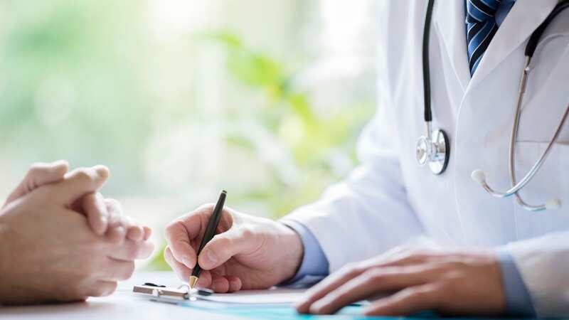 A doctor takes notes in a medical surgery (file image) (Image: Getty Images/iStockphoto)