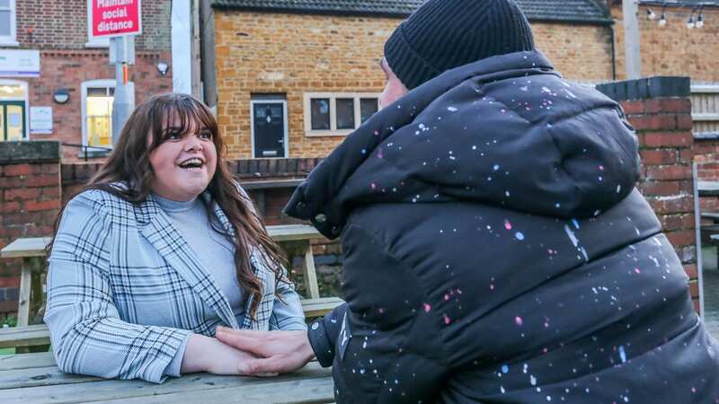Isabel Ainsworth-Smith (left) and the homeless man in Desborough, Northamptonshire (Image: Joseph Walshe / SWNS)