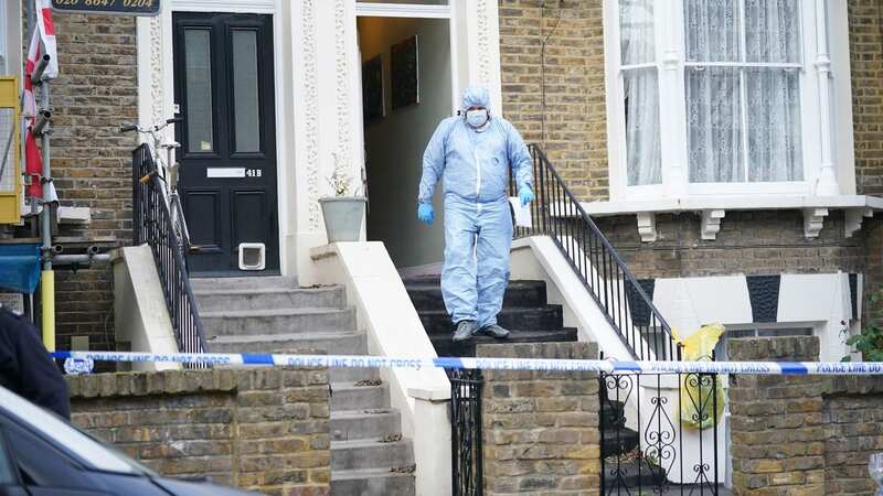 Police at the house in London (Image: PA)