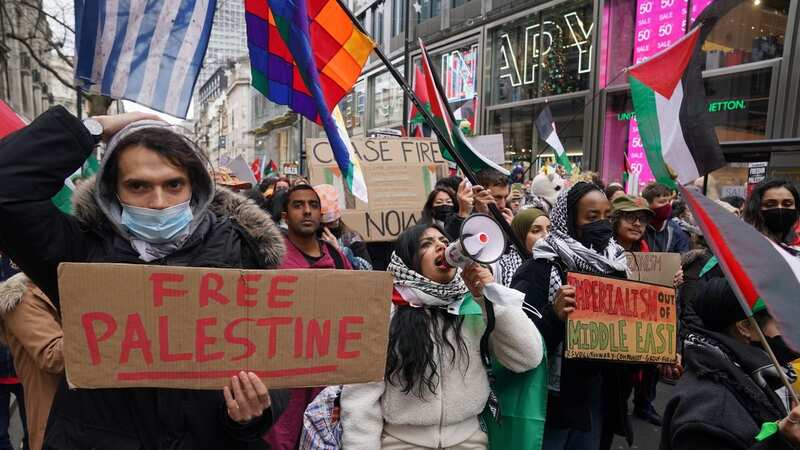 Pro-Palestine protesters march on Oxford Street and chant 