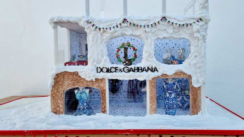 The Dolce Gabbana inspired gingerbread house is made from 15kg of flour and 17kg of sugar - but its most expensive element is the four pink diamonds that adorn the "shop front" (Image: Debbie Wingham / SWNS)