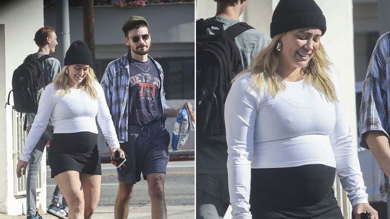 Actress Hilary Duff showcases growing baby bump as she runs errands with her husband Christmas Eve