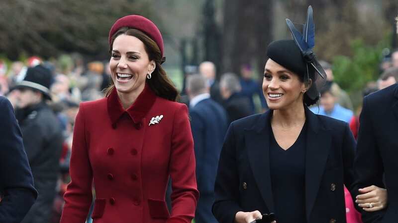 Kate and Meghan smile as they arrive for the Christmas Day morning church service at the Sandringham Estate (Image: PA)