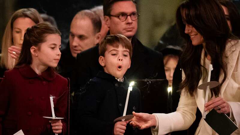 Princess Charlotte watches Prince Louis blowing out his candle during the Together At Christmas service (Image: Getty Images)