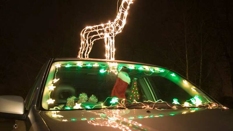 "Decorations shouldn’t be in your way, as it affecting your view out of the windscreen can lead to three points and up to £1,000 in fines." (Image: Getty Images)