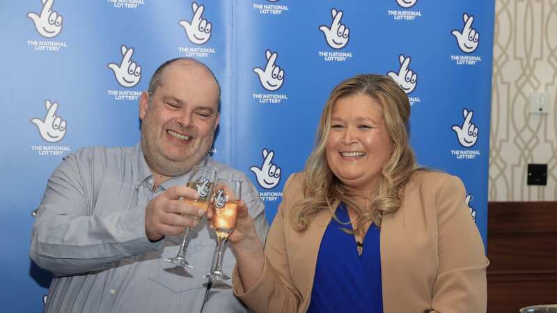 Jonny Johnston and his partner Christina Williams celebrate winning £3.8million (Image: PA)