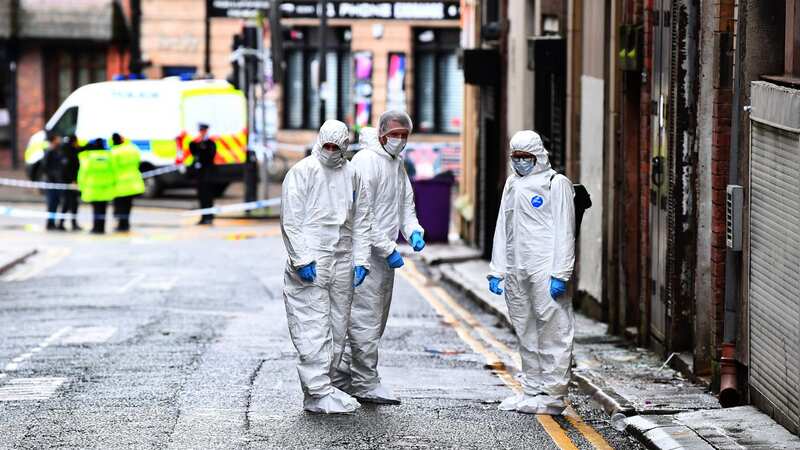 Forensic officers seen on Peter Street (Image: Liverpool Echo)