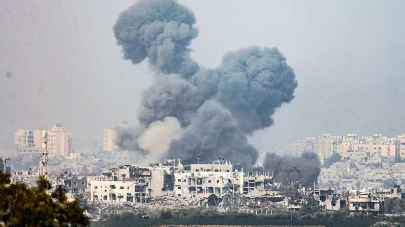 Smoke billows after Israeli missile blitz in Gaza (Image: HANNIBAL HANSCHKE/EPA/REX/Shutterstock)