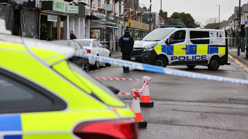 Police along Charminster Road where the shocking dog attack unfolded (Image: BNPS)