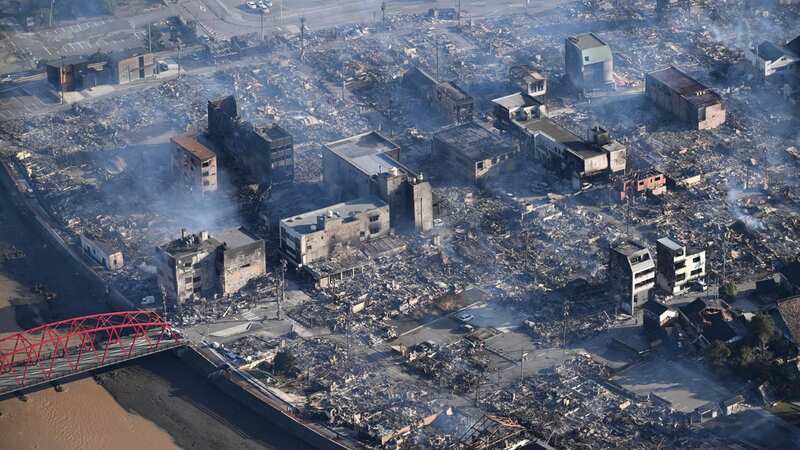 An aerial photo shows burnt buildings in Wajima City, Ishikawa (Image: AP)