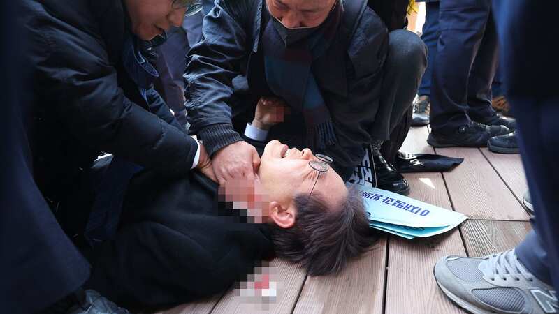 South Korean opposition party leader Lee Jae-myung is attended to after being attacked in Busan (Image: YONHAP/AFP via Getty Images)