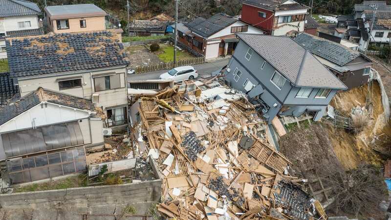 Aerial photo shows damaged and destroyed homes along a street in Wajima, Ishikawa (Image: AFP via Getty Images)