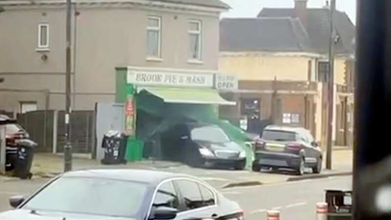 Car repeatedly rams into pie and mash shop before hitting car as it flees scene