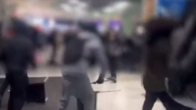 Boxing Day chaos erupts at shopping centre as masked youths hurl chairs in brawl