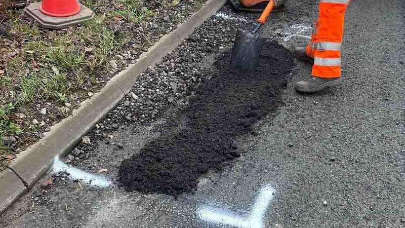 The pothole in Yarnfield Lane being filled in (Image: Stoke Sentinel/BPM Media)