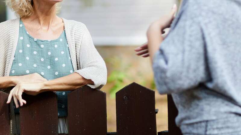 Two women are feuding after one woman offer to clear out her next door neighbour