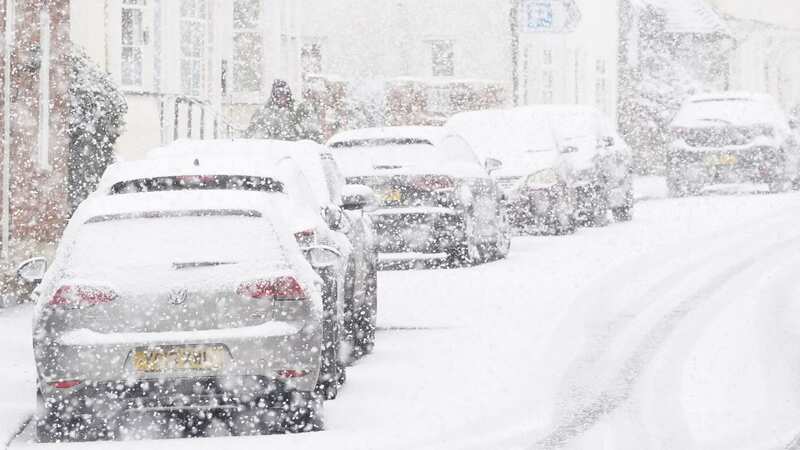 Cars parked during a snow flurry in Lenham, Kent (Image: PA)