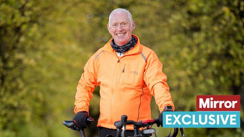 Thrilled Gary lifts up his new bike (Image: MDM)