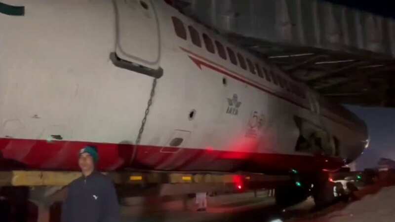 The Air India plane got stuck under a railway bridge (Image: Newslions / SWNS)