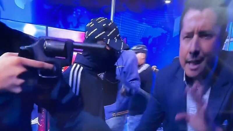 Armed gunmen storm live TV set and hold broadcasters hostage with 