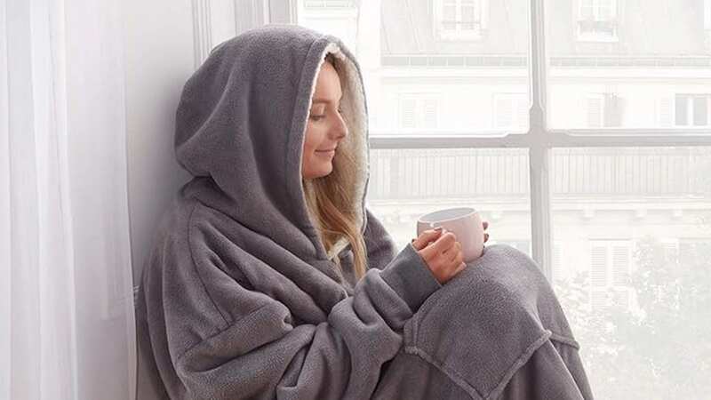 Shoppers are snapping up a hooded blanket that helps keep their heating off (Image: Sienna)