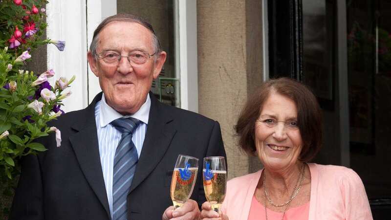 Fred and Maureen Holt collecting their £1million prize (Image: PA)