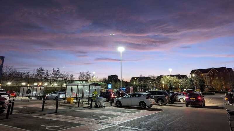 Cat Thompson was just unloading her shopping when she stopped to catch the amazing blue, pink and purple sky (Image: Cat Thompson/TriangleNews)