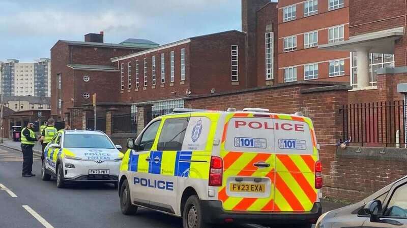 Police outside Lourdes Secondary School in Glasgow (Image: Glasgow Live)