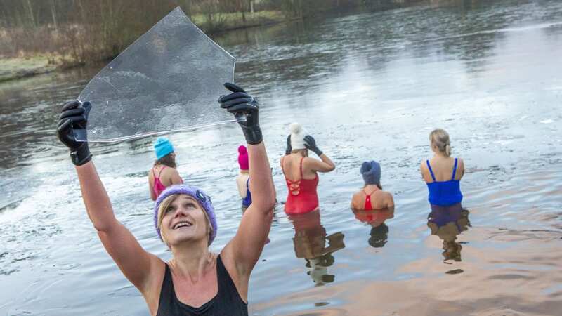 Wild swimmers break ice on frozen water for a Sunday morning dip at Avon Lagoon, Linlithgow, West Lothian, (Image: Katielee Arrowsmith SWNS)