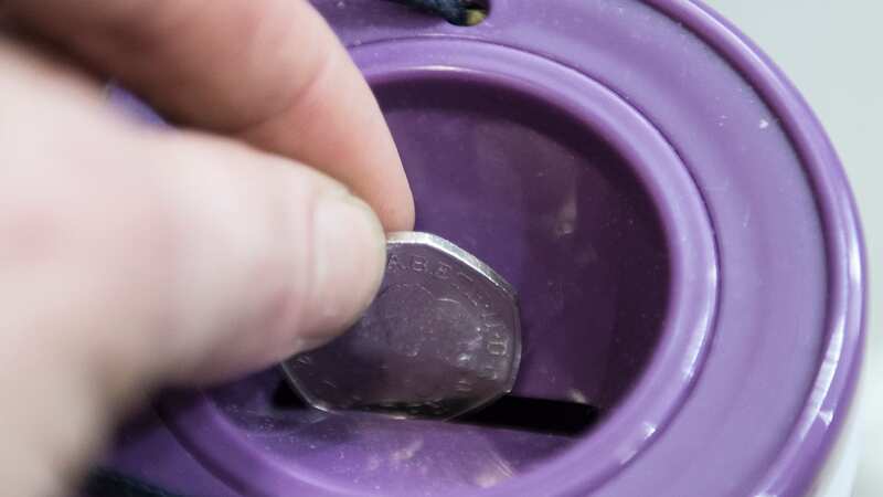 A coin is dropped into a charity collection container (Image: PA Archive/PA Images)