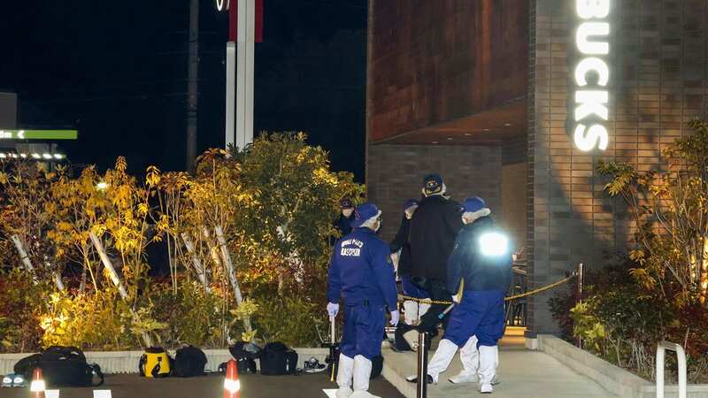 Investigators work at the site of a shooting in Shikokuchuo City (Image: AP)