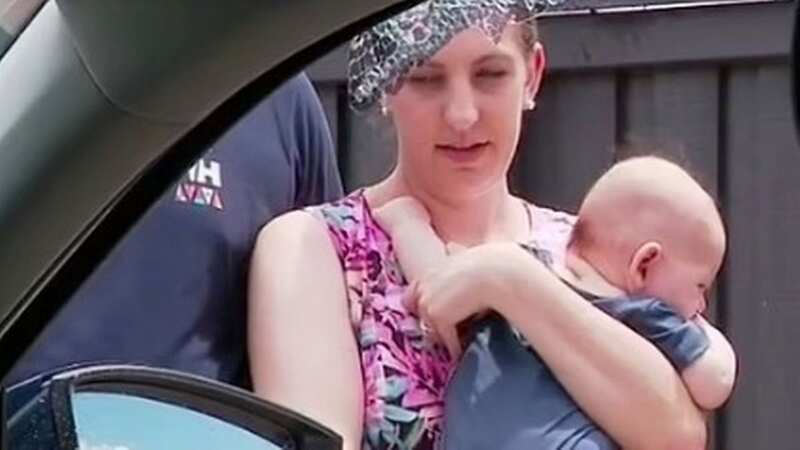Sarah Cianci with her baby near the shattered window (Image: Nine)