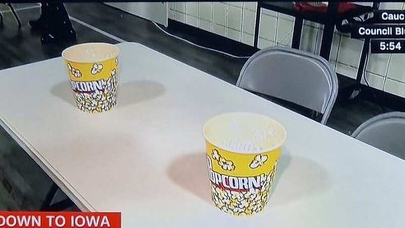 Iowa caucus voters are given popcorn buckets to hold official votes submitted via notepad (Image: CNN)