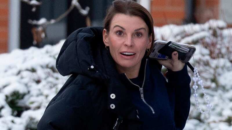Coleen Rooney wrapped up warm in the snow (Image: SplashNews.com)
