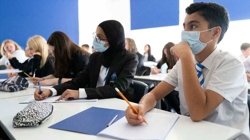 Children wear face masks in school in Cardiff, Wales (Image: Getty Images)